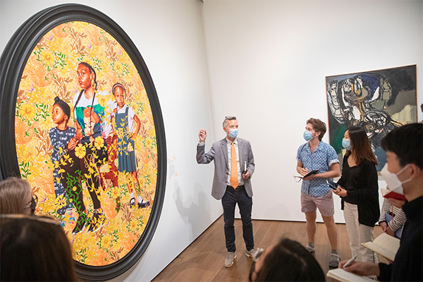 Robin Kelsey and students discuss “Portrait of Asia-Imani, Gabriella-Esnae, and Kaya Palmer” by Kehinde Wiley, American
